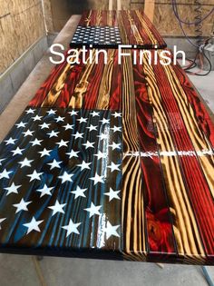 an american flag made out of wood with the words satin finish painted on it's side