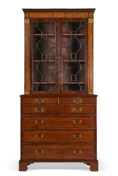 an old fashioned wooden cabinet with glass doors