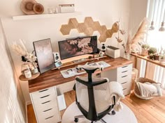 a home office with white furniture and wood accents