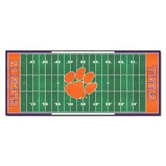 an orange and white football field with the word clemson on it's sideline