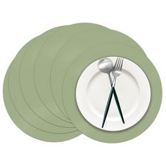 four green placemats with forks and spoons on them, set against a white background