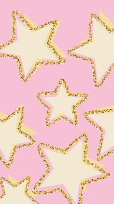 gold glitter stars on pink background