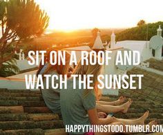 two people sitting on top of a roof with the words sit on a roof and watch the sunset