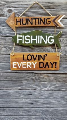 two wooden signs that say hunting, fishing and lovin'every day