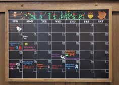 a chalk board with the calendar written on it