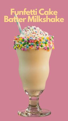 an ice cream sundae with sprinkles and a straw in it on a pink background