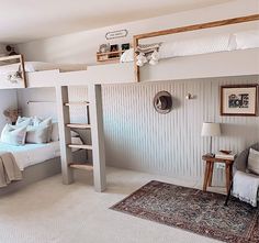 a bedroom with bunk beds and white walls