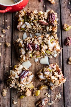 granola bars with nuts and milk on a wooden table