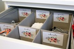 several drawers with cards in them and some flowers on the top one is labeled short