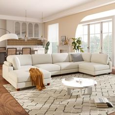 a living room filled with furniture and a white rug on top of a hard wood floor