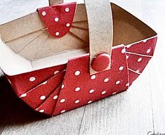 an origami box with polka dots on it