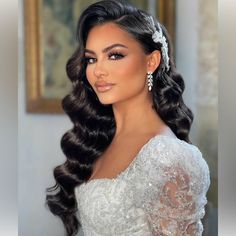 a woman with long hair wearing a wedding dress