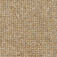 the texture of an upholstered fabric with brown and tan colors, closeup