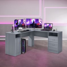 a computer desk with three monitors and a keyboard in front of it on top of a pink carpeted floor