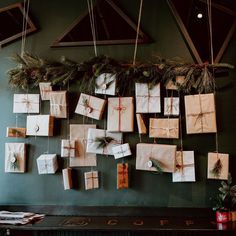 many wrapped presents are hanging on the wall