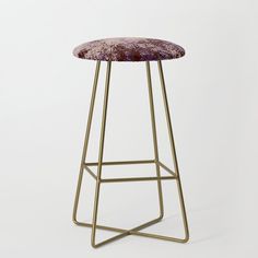 a stool with a purple velvet seat and gold metal frame, on a white background