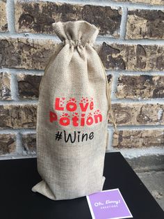 a wine bag sitting on top of a table next to a sign that says love petition