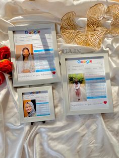 three frames with pictures on them sitting next to a red rose and two gold heart brooches