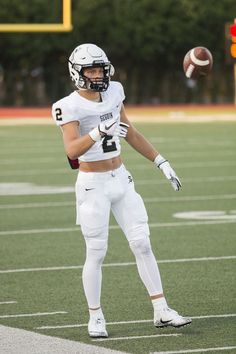 a football player throwing a ball on the field