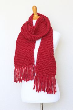 This chunky knit scarf is a cozy addition to any modish fall/winter wardrobe. It's made with wool blend yarn in lovely red (Cranberry) color.The scarf is long, soft and comfy.Please note: I can make this scarf in many other colors. Just contact me for more info.Shown color: Cranberry.Machine wash and dry when needed. Red Scarves For Winter Cold Weather, Red Winter Scarves For Cold Weather, Cozy Red Scarves For Winter, Red Knitted Scarf For Winter, Red Knitted Scarf For Fall, Red Knitted Fall Scarf, Red Knitted Fall Scarves, Mens Knitted Scarf, Chunky Knit Scarf