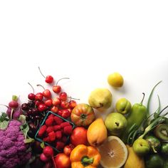 there are many different fruits and vegetables on the table