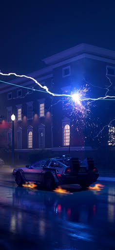 two police cars parked in front of a building at night with firework on the roof