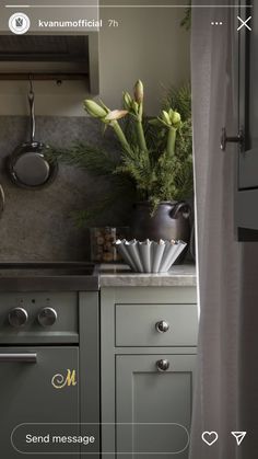 an image of a kitchen setting with flowers on the counter