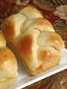 three rolls sitting on top of a white plate