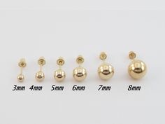 A pair of Fabulous 14k Yellow Gold Ball Stud Earrings!! These earrings are made from real 14k gold and have a great shine. The prices in the listing are for a pair. Material: 14k real gold, Hollow on the inside Ball Sizes: From left to right: 3 mm= 8 mm long post, recommended for kids and thin ear lobes 4 mm= 8 mm long post, recommended for kids and thin ear lobes 5 mm = 9 mm long post, recommended for adults and thin ear lobes 6 mm = 9 mm long post, recommended for adults and thin earlobes 7 mm Large Gold Stud Earrings, 3 To 4 Grams Gold Earrings, Gold Studs Earrings Indian Round, Small Gold Hoop Earrings With Ball, Ball Stud Earrings, Gold Ball Stud Earrings, Small Earrings Gold, New Gold Jewellery Designs, Engagement Mehndi Designs