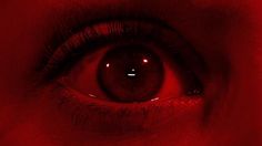 an eye with red light reflected in it