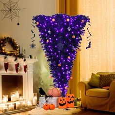 a living room decorated for halloween with purple lights and decorations on the fireplace mantel