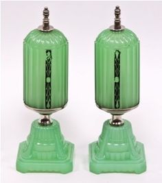 two green vases sitting on top of each other