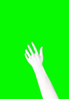 a person's hand reaching up into the air with their arms extended in front of a green screen