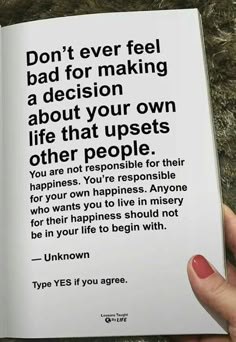 a person holding an open book in their hand with the words don't ever feel bad for making a decision about your own life that upsets other people