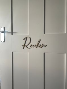 a white door with the name reuben on it