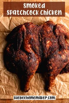 two pieces of chicken sitting on top of a piece of wax paper with the words smoked spat