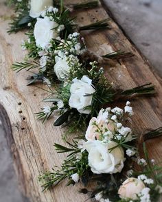 the flowers are laid out on the wooden planks to be used as flower arrangements