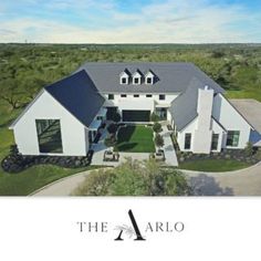 an aerial view of a large white house