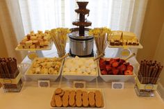 an assortment of desserts and snacks displayed on a table