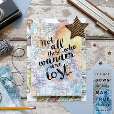 a card that says not all those who wander are lost on top of a table