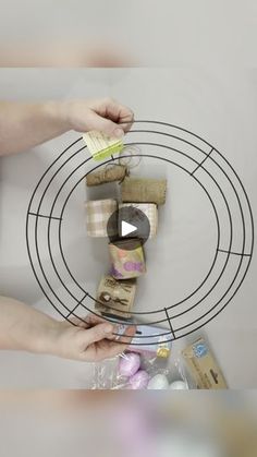 two hands reaching for some kind of food on a wire rack with other items around it