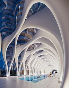 the interior of a modern building with blue and white architecture