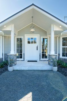 a white front door on a gray house