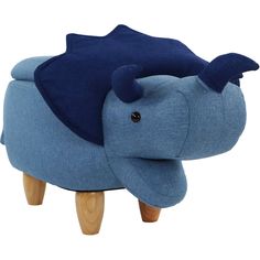 an elephant shaped stool with blue fabric covering on it's head and wooden legs