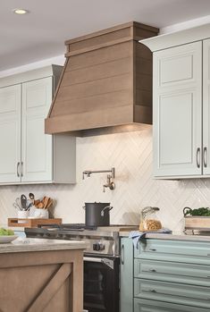 a kitchen with blue cabinets and an oven