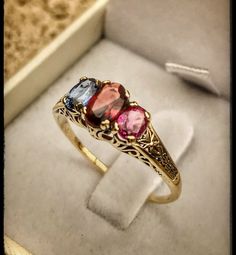 "Very unique handmade gold ring with real gemstones . 14k gold antique victorian ring with a real garnet stones in the middle + 1 real beautiful ruby in the side + one real beautiful sapphire on the other side . Hand made by myself Weight : about 1.9 gram Central stone : garnet 4/6 m\"m Ruby stone : 3/5 mm Sapphire stone : 3/5 mm" Antique 14k Gold Ruby Ring With Multi-stone, Elegant Three-stone Birthstone Ring In 14k Gold, Elegant Three Stone Birthstone Ring In 14k Gold, Antique Multi-stone Yellow Gold Jewelry, Antique Yellow Gold Multi-stone Jewelry, Antique 14k Yellow Gold Ruby Ring, Elegant Three Stone Collectible Ring, Victorian Multi-stone Ruby Ring, Unique Yellow Gold Sapphire Ring With Accent Stones