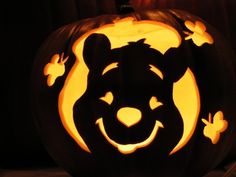 a carved pumpkin with an animal face on it