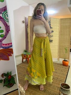 This unique wrap skirt is a one of a kind in the hole world ✨ The fabric goes on it's one unique story as it is a  one of a kind recycled vintage silk hand picked from unique places and villages 🌱 The fabric also  is so soft and silky and has so many small details that make just that much more Beautiful  ⚛️ It's a 2 in 1 skirt ! As you can where it in its 2 defrent sides✨ Skirt is great for every day, And also luxurious and Stunning for evening where. 🌞 Fabric is is the best thing about it, An Silk Wrap Skirt Outfit, Flowy Wrap Skirt, Traditional Long Wrap Skirt For Beach, Layered Wrap Skirt, Bohemian Wrap Skirt For Vacation, Bohemian Long Sarong Skirt For The Beach, Bohemian Maxi Skirt For Festivals, Hippie Festival Ruffled Skirt, Bohemian Ruffled Midi Skirt