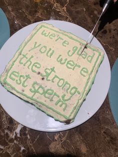 a cake that is sitting on a plate with the words we're glad you were the strongest person