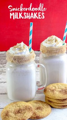 two mugs filled with milk and cookies next to each other